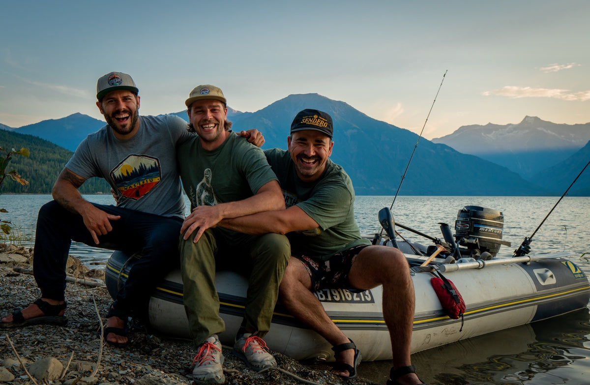 Three friends beside their boat at Kinbasket Lake