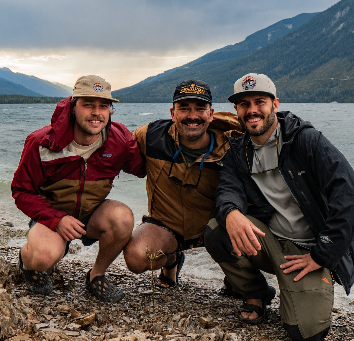 Three friends on the rocky shore of Kinbasket Lake