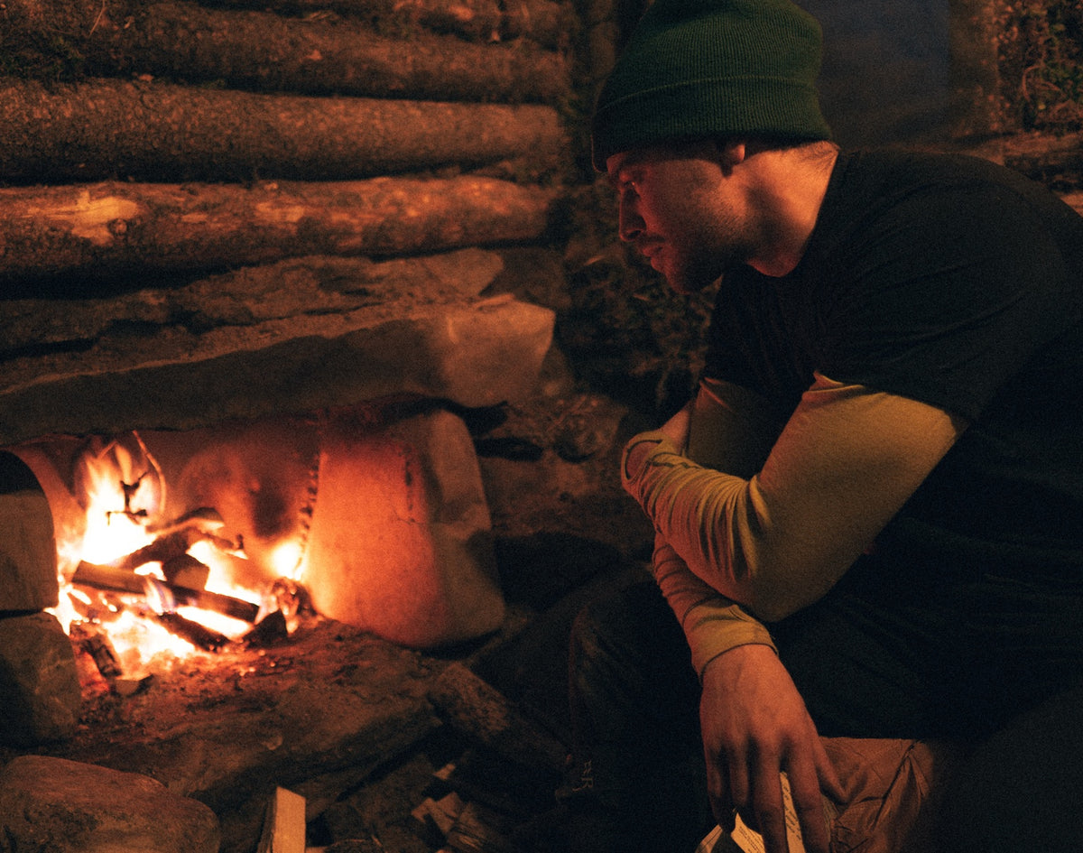 A quiet moment beside the first cabin fireplace